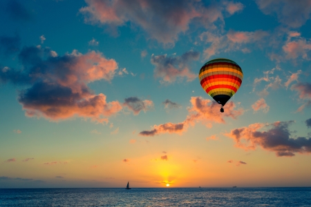 Hot air balloon with sunset at the sea backgroundの写真素材