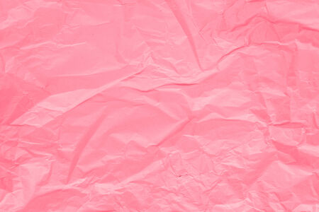Texture of pink crumpled paper for background