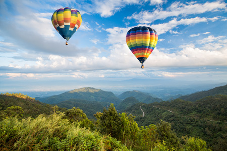 Hot air balloon over the mountainの写真素材