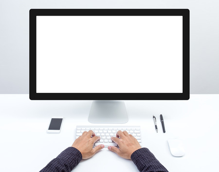 Man hand on desktop keyboard with blank screen monitorの写真素材