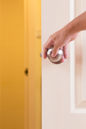 Man hand locking door knobの写真素材