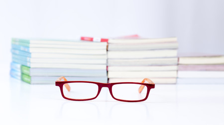 Eyeglasses with stack of book backgroundの写真素材