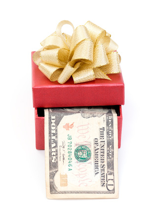Red gift box with dollar bills on white backgroundの写真素材