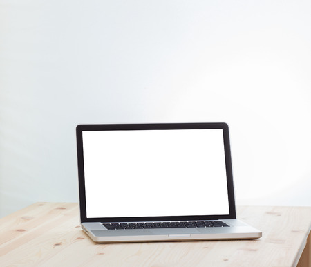 Blank screen laptop computer on wood tableの写真素材