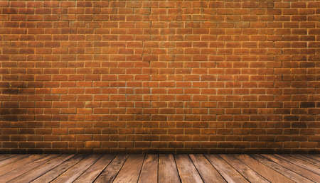 Wood floor and red brick wall backgroundの写真素材