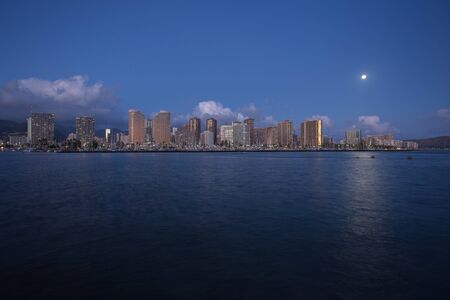 Honolulu skyline with seafront at sunset, Hawaiiの写真素材