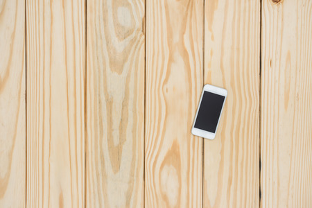 Smartphone on wooden backgroundの写真素材