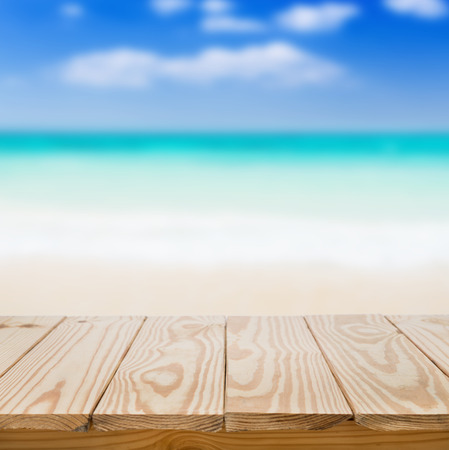 Wood table and blue sea background