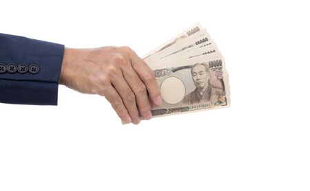 Businessman hand holding Japanese Yenの写真素材