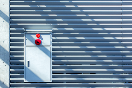 Fire alarm box with metal sheet wall backgroundの写真素材