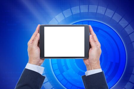 Businessman hands holding blank screen digital tablet on blue digital graphic background