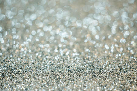 Silver festive glitter bokeh background with defocusedの写真素材