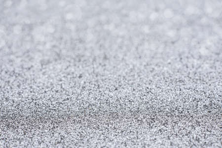 Silver festive glitter bokeh background with defocusedの写真素材