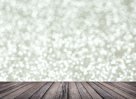 Wood table top with blur silver bokeh backgroundの写真素材