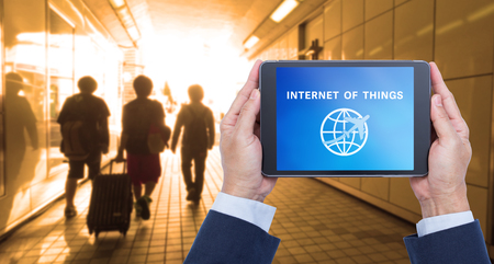 Businessman hands holding digital tablet computer with internet of things on screenの写真素材