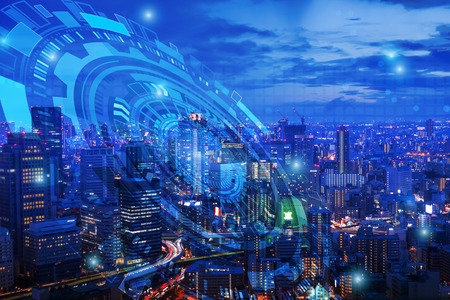 Double exposure of night cityscape with technology graphic designの写真素材