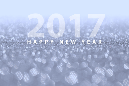 Happy new year 2017 on selective focus silver bokeh use for background