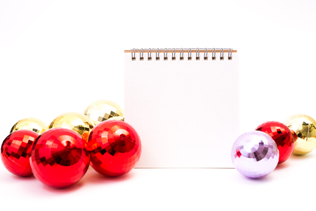 Blank calendar with christmas ball on white backgroundの写真素材