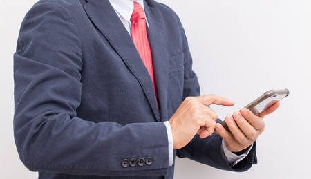 Unrecognizable Businessman hand holding smartphoneの写真素材