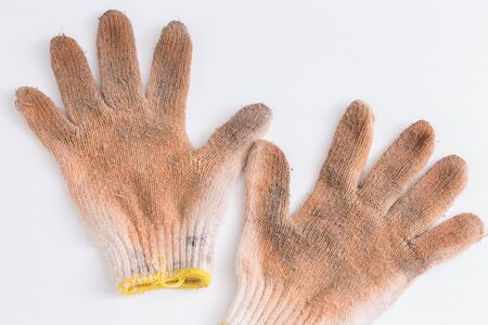 Dirty gloves on white backgroundの写真素材