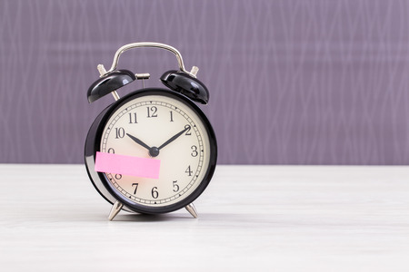 Vintage clock on table