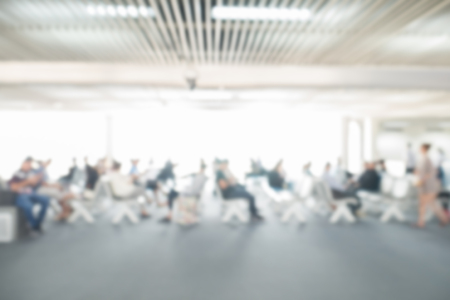 Blurred image of business people traveling at the ariport. use for brochure cover web design template backgroundの写真素材