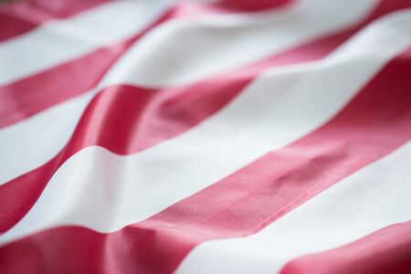 Crumpled red strip flagの写真素材