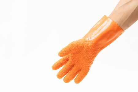 Durable gloves for peeling vegetable and cooking on white backgroundの写真素材
