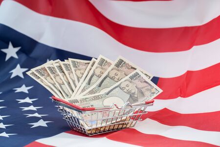Basket of Japanese 10000 yen with America flag