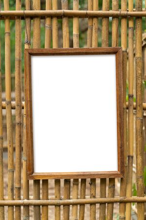 Blank Wooden photo frame with bamboo wallの写真素材