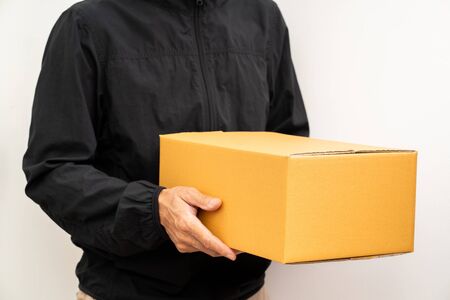 Unrecognized man delivery box of parcelの写真素材