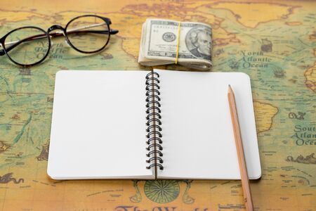 Blank diary notebook on world map. Travel around the world conceptの写真素材