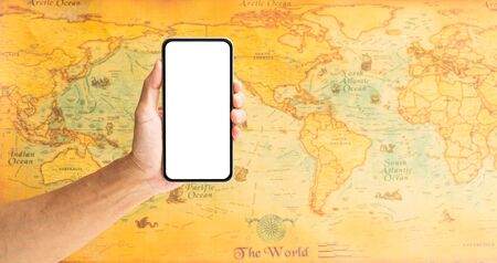 Man hand holding smartphone with world map on background