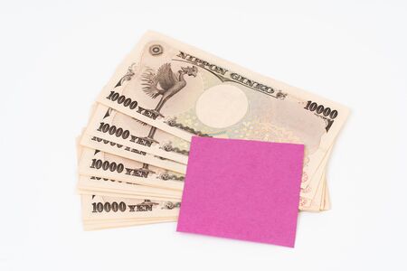 Ten thousand yen banknote with post note paperの写真素材