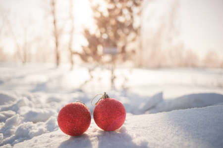 Christmas decoration balls on snow driftの写真素材