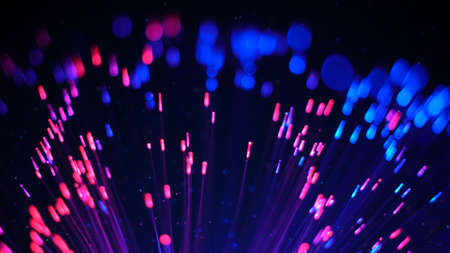 Blue and red fibre optic lights and glowing particlesの写真素材