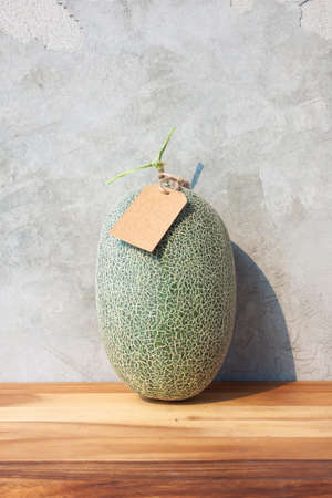 melon fruit on wooden tableの写真素材