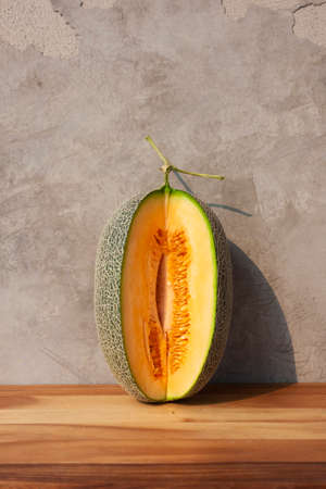 melon fruit on wooden tableの写真素材