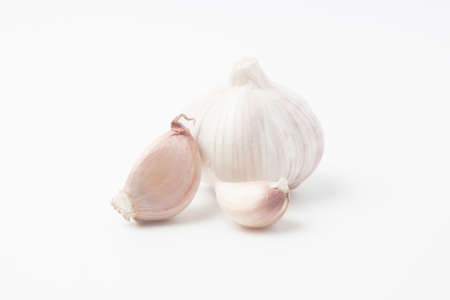 garlic isolated on white backgroundの写真素材