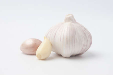 garlic isolated on white backgroundの写真素材