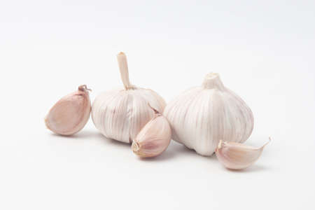 garlic isolated on white backgroundの写真素材