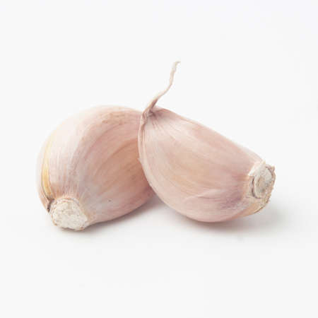 garlic isolated on white backgroundの写真素材