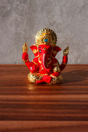 Ganesha statue on wooden background. Ganesha is a Hindu god.の写真素材