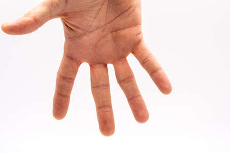 men's open hand on white background in light boxの写真素材