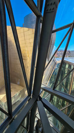 Design of metal structure of modern interior architecture with glass elements.
