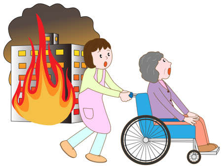 Old man in a wheelchair to take shelter in a building fire and careの素材 [FY31049170722]