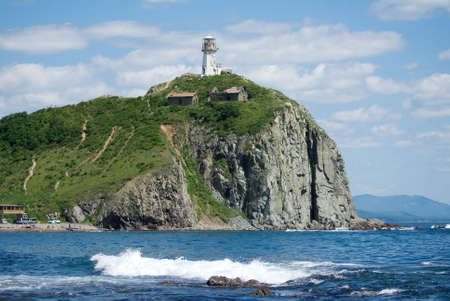 Beacon on a rock on coast of sea of Japanの写真素材