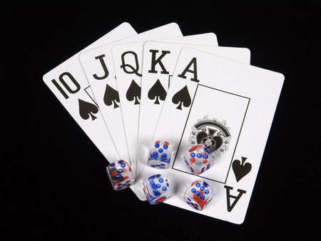 Playing cards and playing bones on a black backgroundのeditorial素材