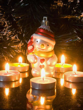 decoration for fir tree and candles on black backgroundの写真素材