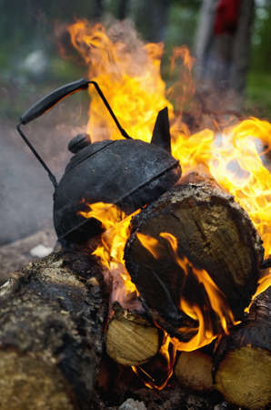 Black tea is on the burning woodの写真素材